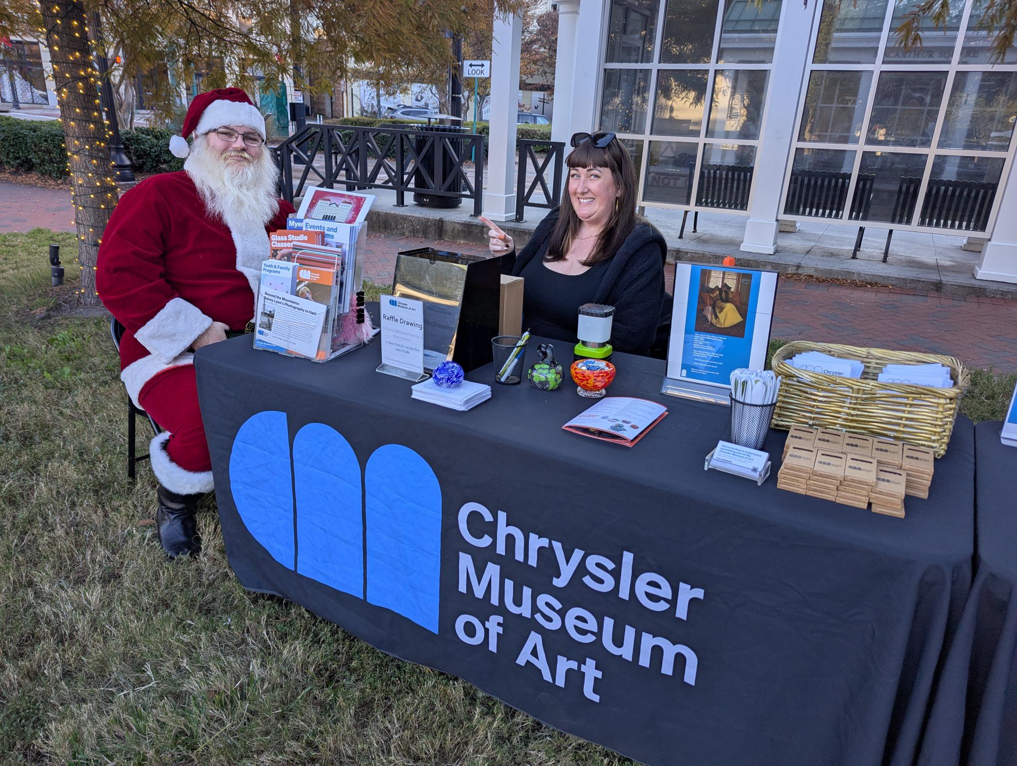 Santa visiting the Chrysler Museum of Art Outreach table
