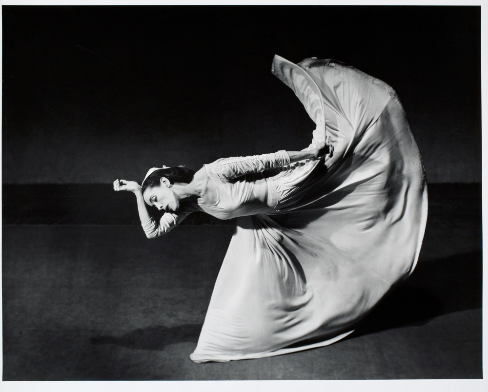 Image of woman in motion and dress