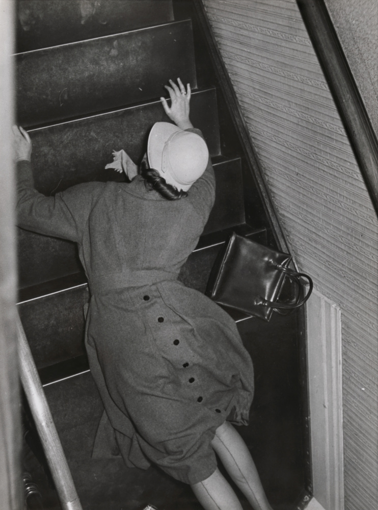 Image by Elizabeth Hase, Woman falling on stairs.