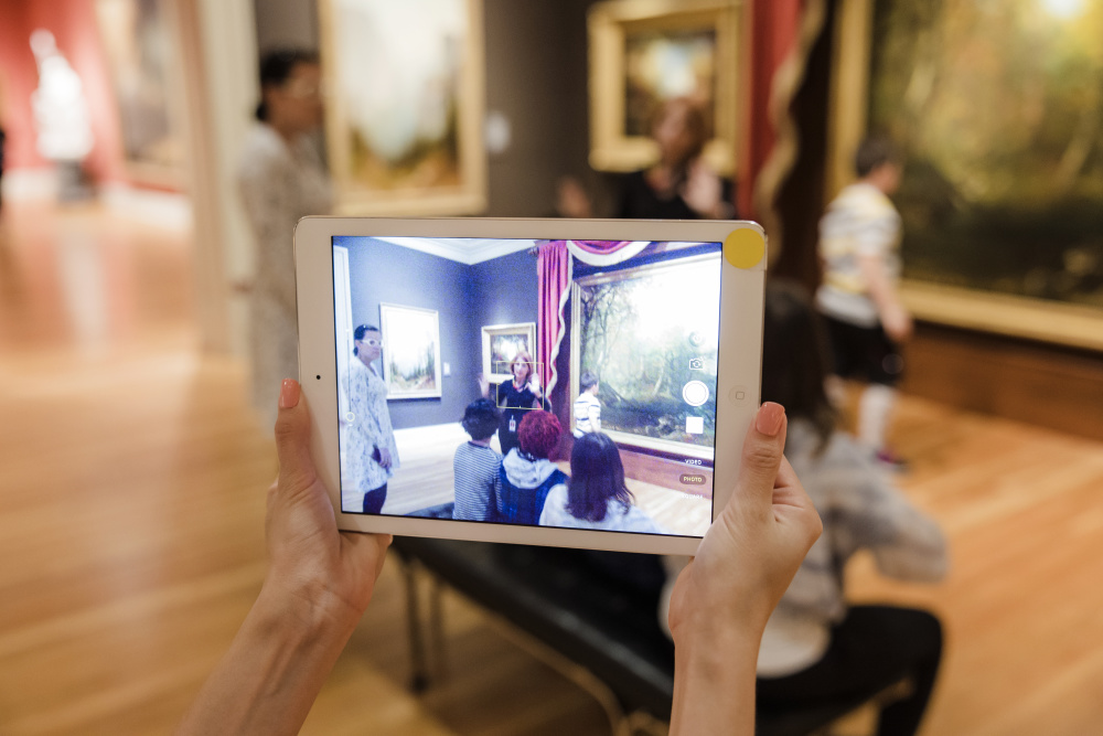 Visitor taking photo in the galleries