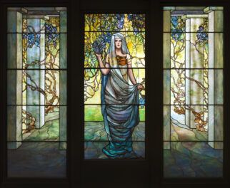 Tiffany Studios (American, 1902-1932) Woman in a Pergola with Wisteria ca. 1910-14 Leaded glass with copper foil, stain, and enamel Gift of Walter P. Chrysler, Jr. 78.477