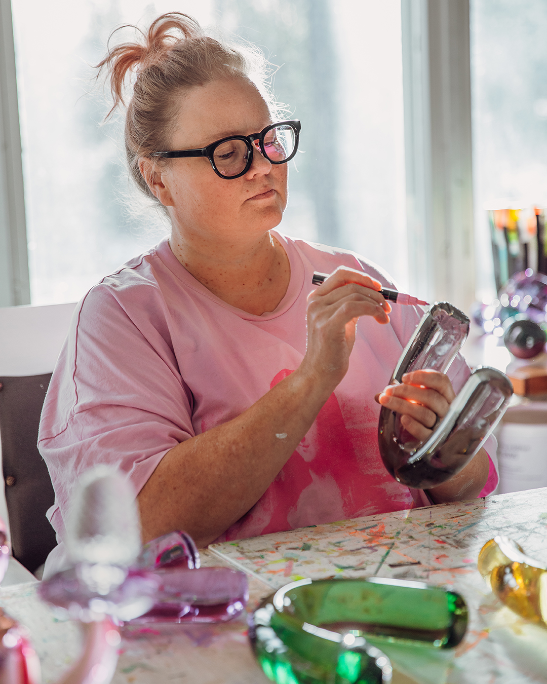 Anu Penttinen working on glass art