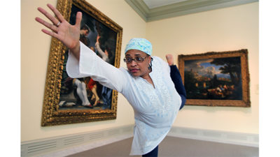 Photo of yoga instructor, Tenesha Bazemore, in the Chrysler gallery.