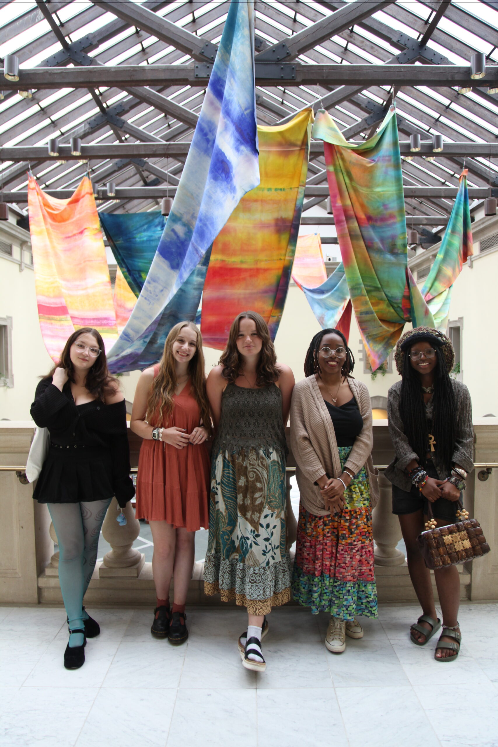 Teens posing at the top of the Huber Court staircase