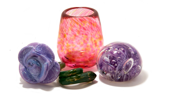 purple glass rose, pink cup, and paperweight