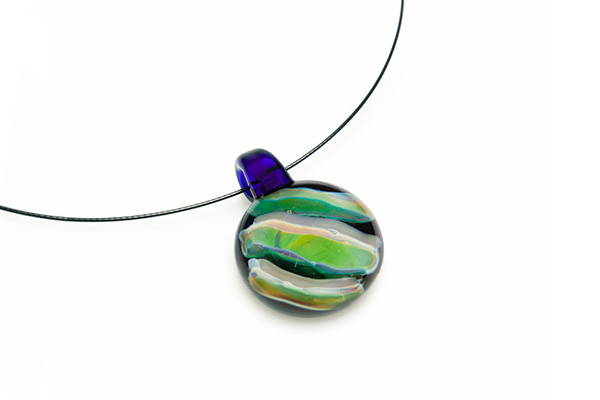 blue, yellow, and clear glass round pendant