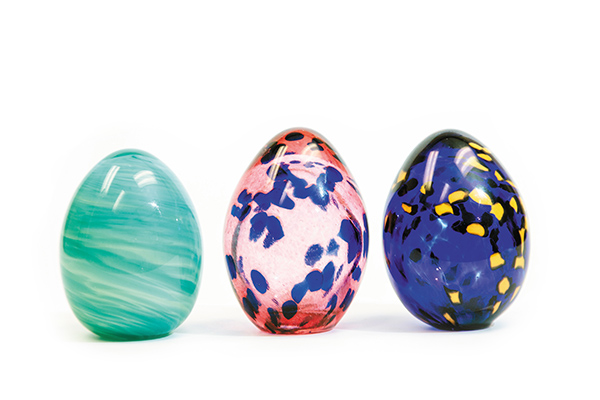 three colorful glass eggs