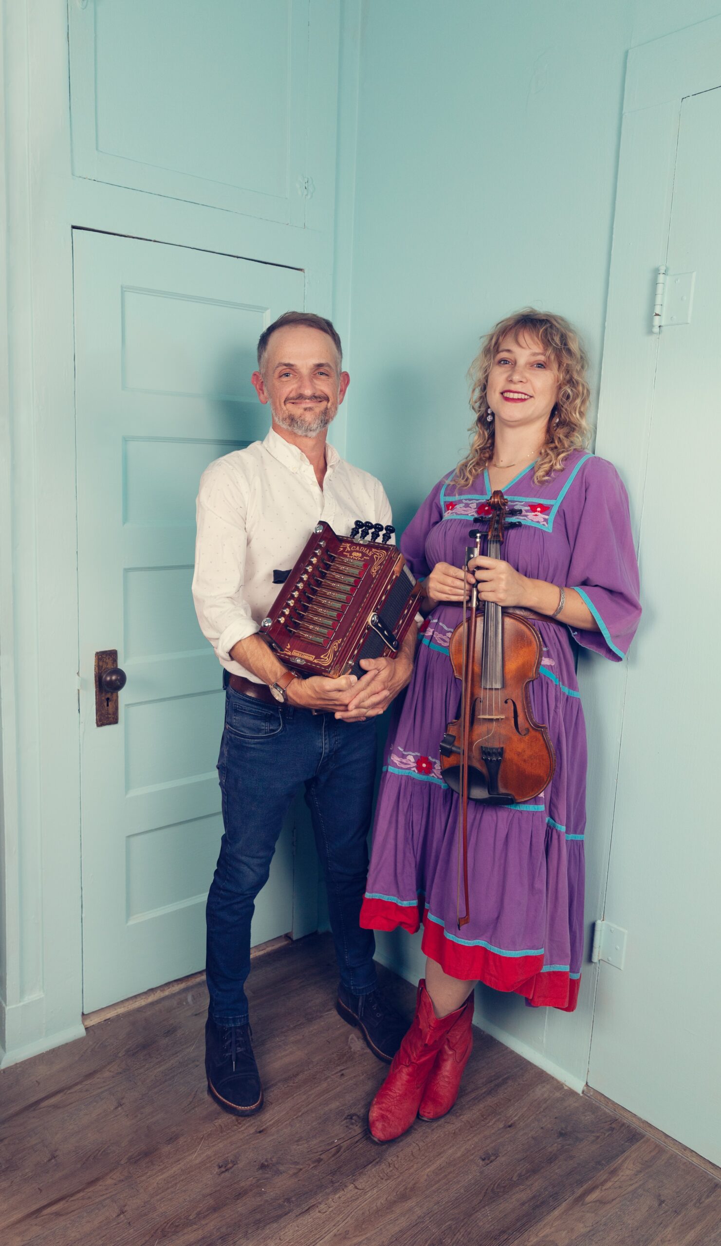 T'Monde posing with their instruments