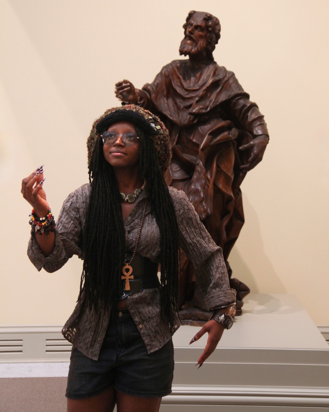 Portsmouth Public School Teen mimicking statue in gallery.