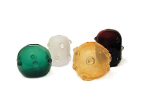 Four glass ornamented balls
